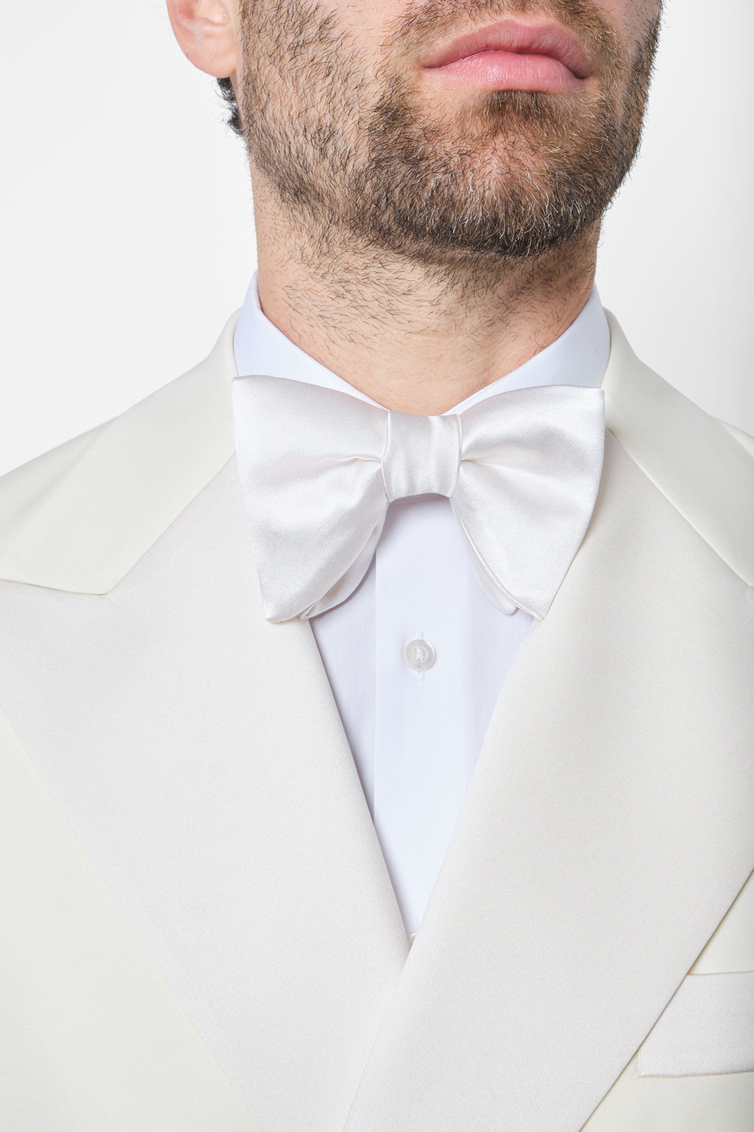 White jacket and black pants tuxedo