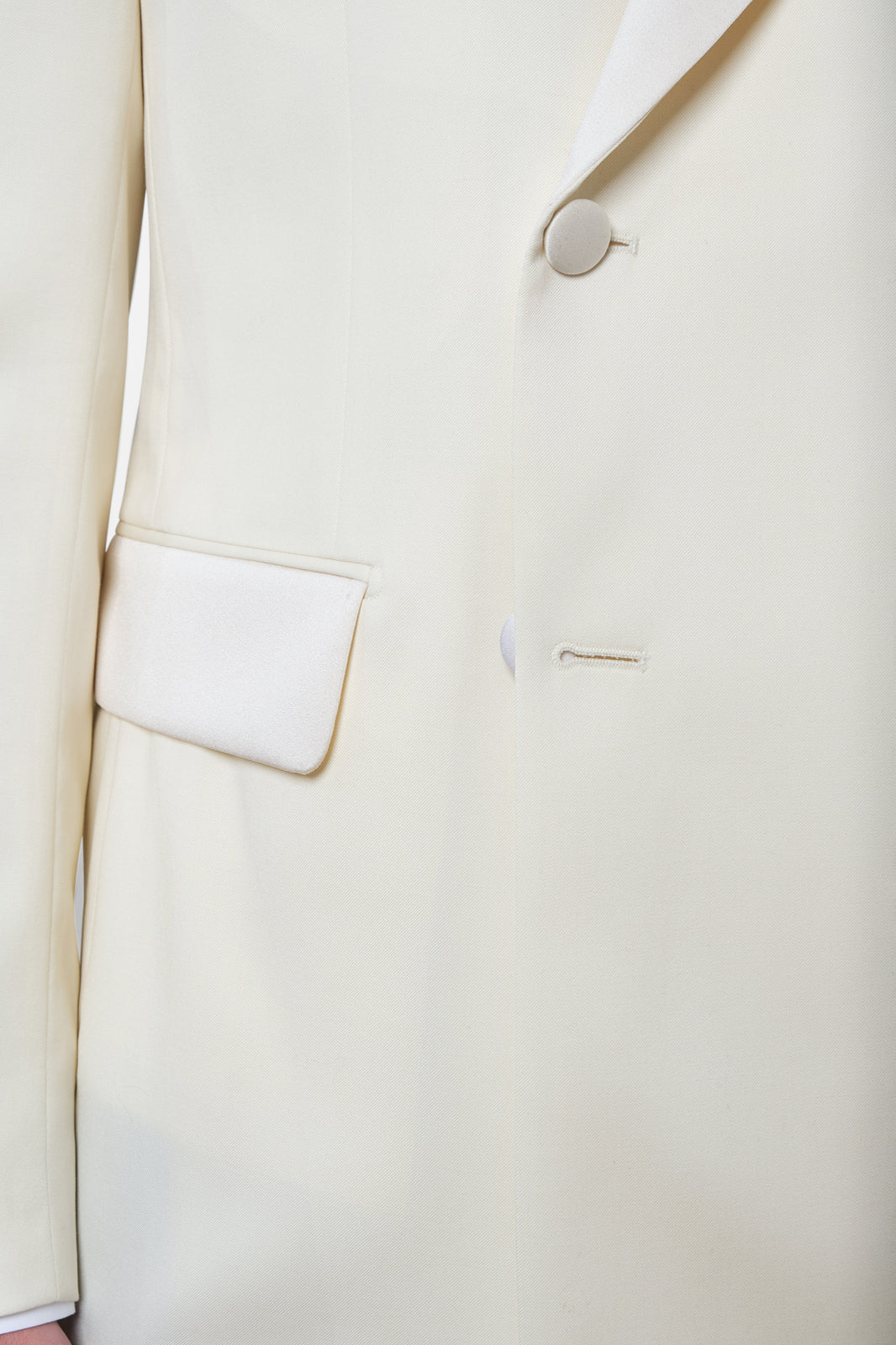 White jacket and black pants tuxedo