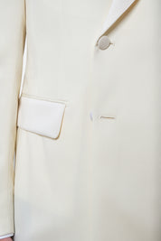 White jacket and black pants tuxedo