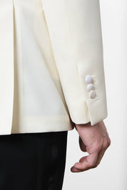 White jacket and black pants tuxedo