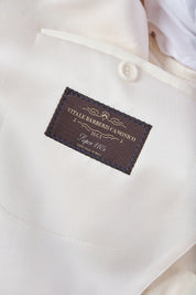 White jacket and black pants tuxedo