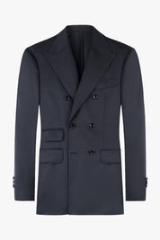 Veste de costume croisée gris anthracite avec six boutons, de larges revers en pointe et plusieurs poches à rabat sur le devant.