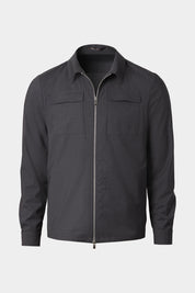 Vue sur fond blanc d'un blouson gris zippé en laine et élasthane sur un tissu de chez Reda