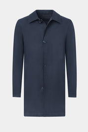 Vue sur fond blanc d'un imperméable réversible en laine et matière technique.