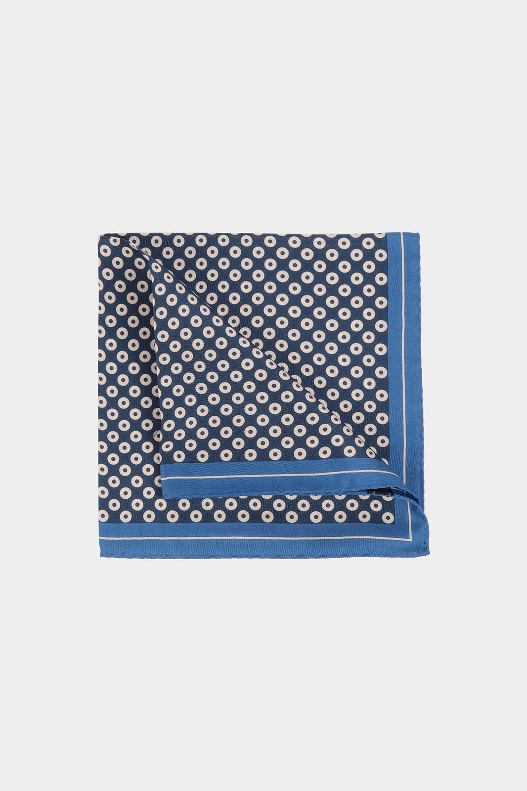 Pouch with blue background and black and white circle print