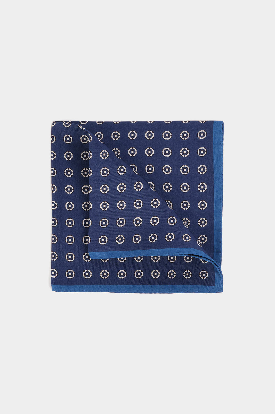 Navy background pouch with aligned white flower pattern