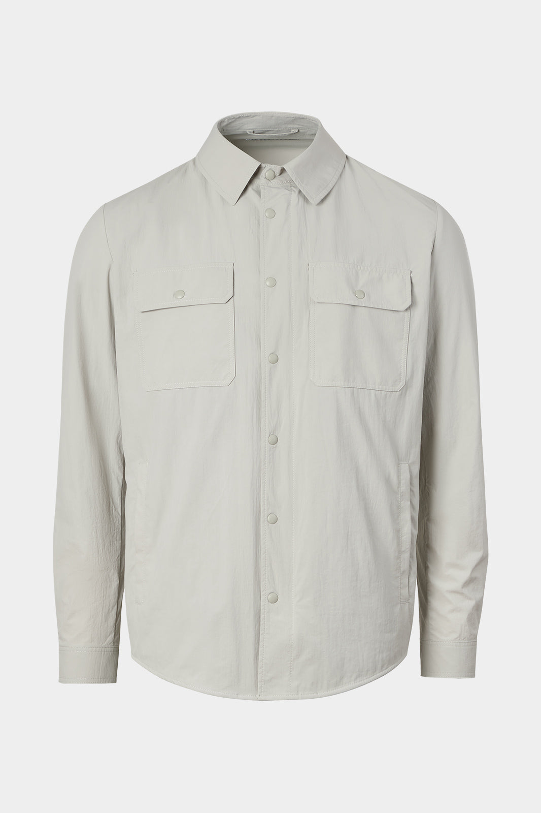 Vue sur fond blanc d'une sur chemise grise en tissu 100% polyamide.