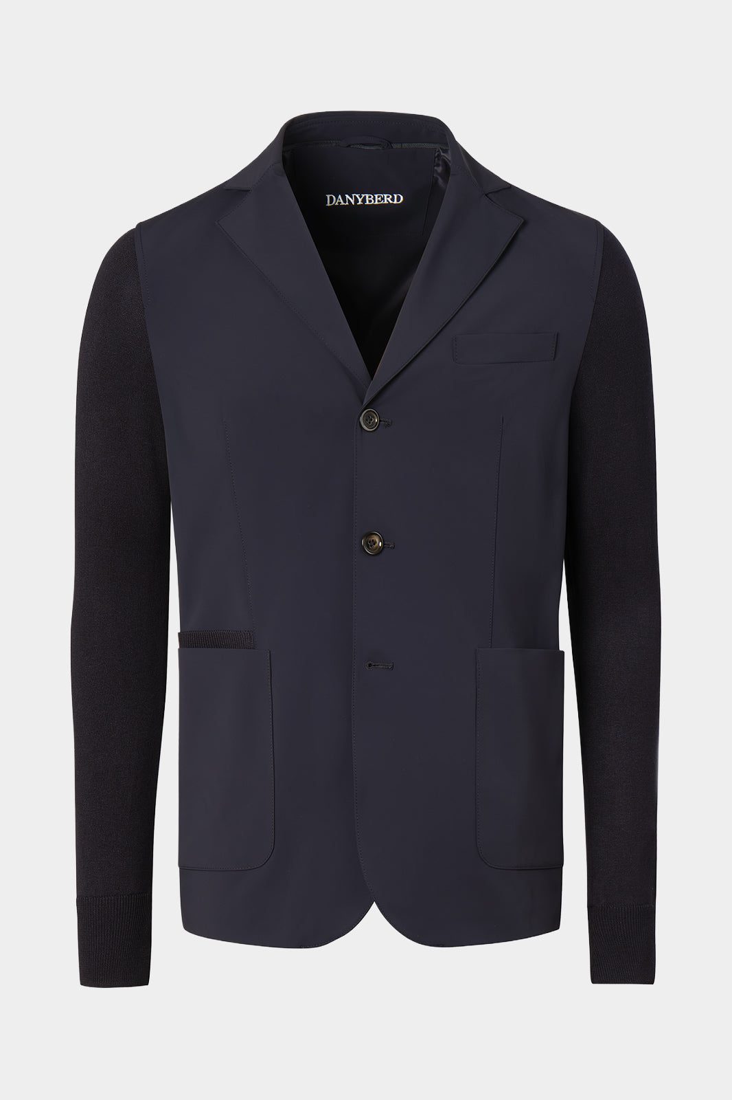 Veste bi-matière à capuche amovible de couleur marine. Tissu italien.