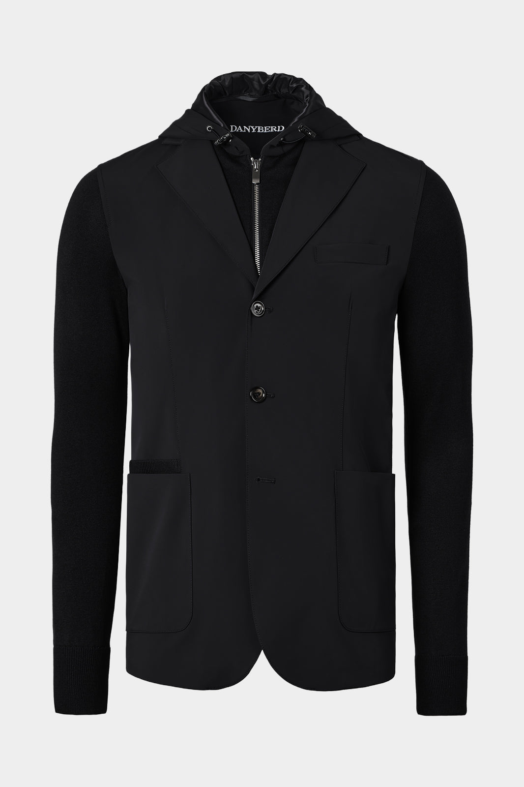 Veste bi-matière à capuche amovible de couleur noire. Tissu italien.