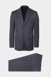 Vue sur fond blanc d'un costume revers flèche et pantalon patte de serrage en marine sur une 100% laine d'Italie de chez Vitale Barberis Canonico. 