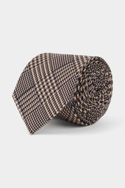 Vue sur fond blanc d'une cravate pour homme en 100% soie made in Italie imprimé princes de galles marine et beige.