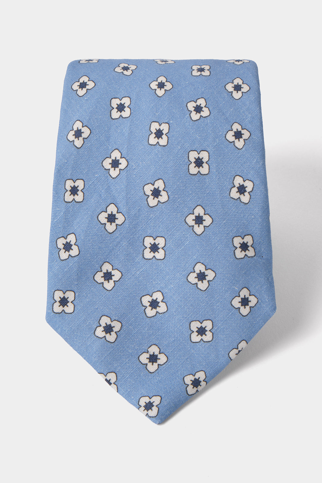 Cravate en soie et lin  –  Bleu clair à motifs fleurs blanches et bleues