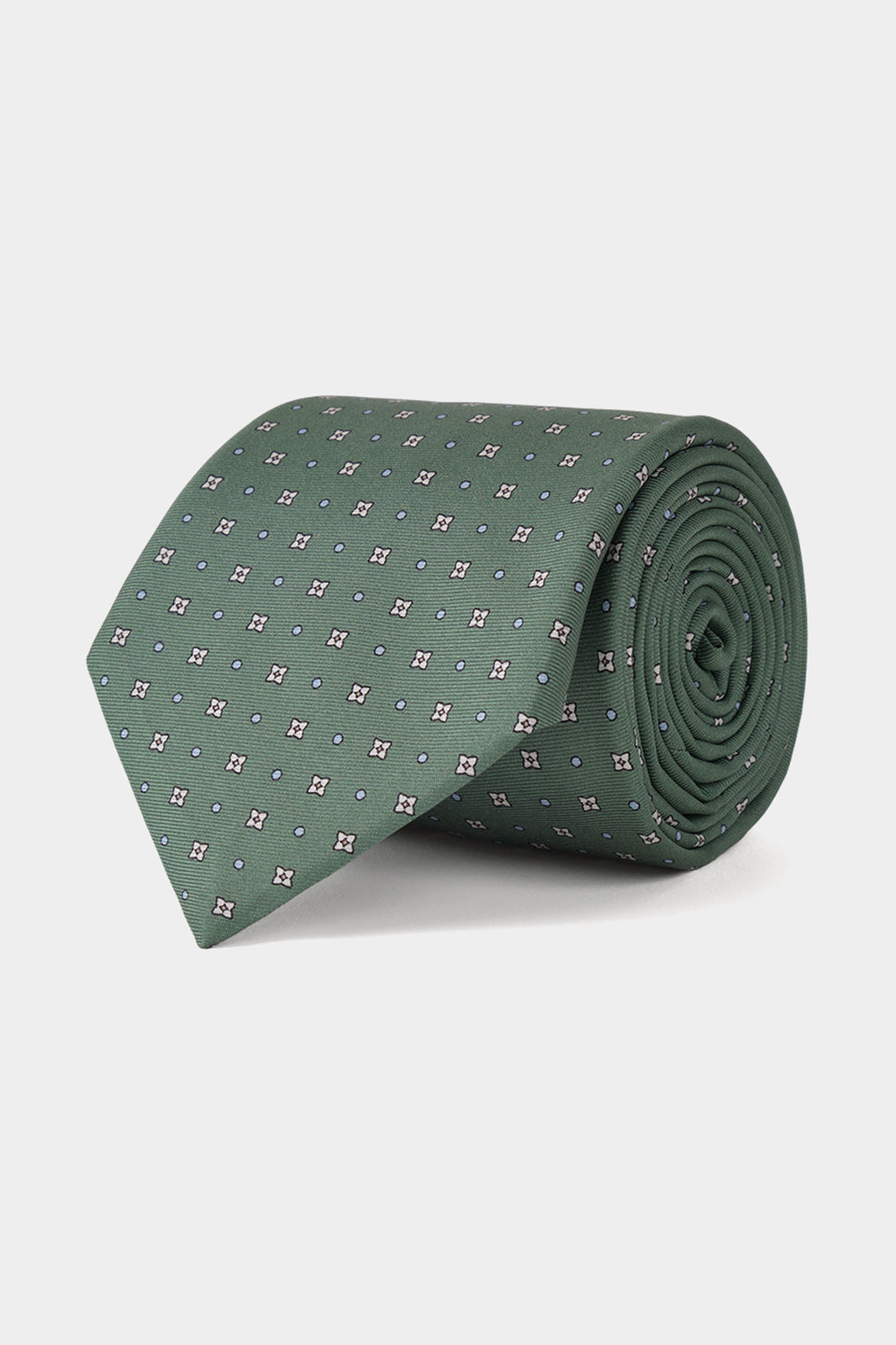 Cravate fabriquée en 100 % soie de couleur vert à motifs fleurs.