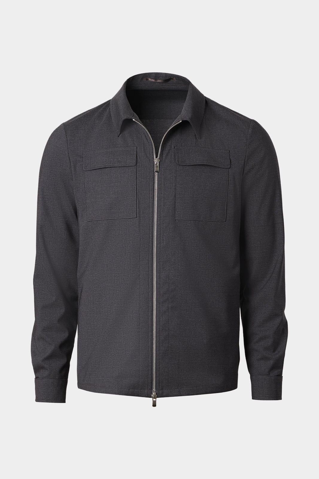 Vue sur fond blanc d'un blouson gris zippé en laine et élasthane sur un tissu de chez Reda 