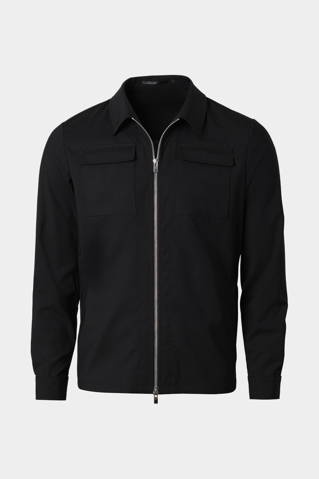 Vue sur fond blanc d'un blouson noir zippé en laine et élasthane.