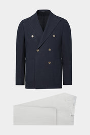 Vue sur fond blanc d'un costume croisé couleur marine et pantalon à patte de serrage blanc. Tissus italiens en 52% viscose et 48% lin de chez LeoMaster.