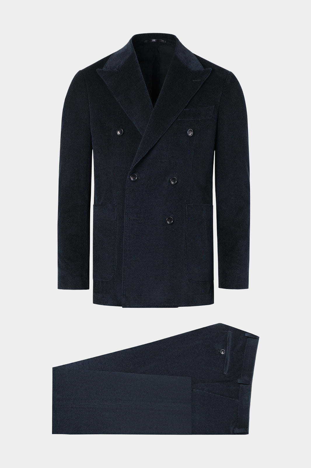 Vue sur fond blanc d'un costume croisé en velours côtelé en marine sur un tissu made in Italy.