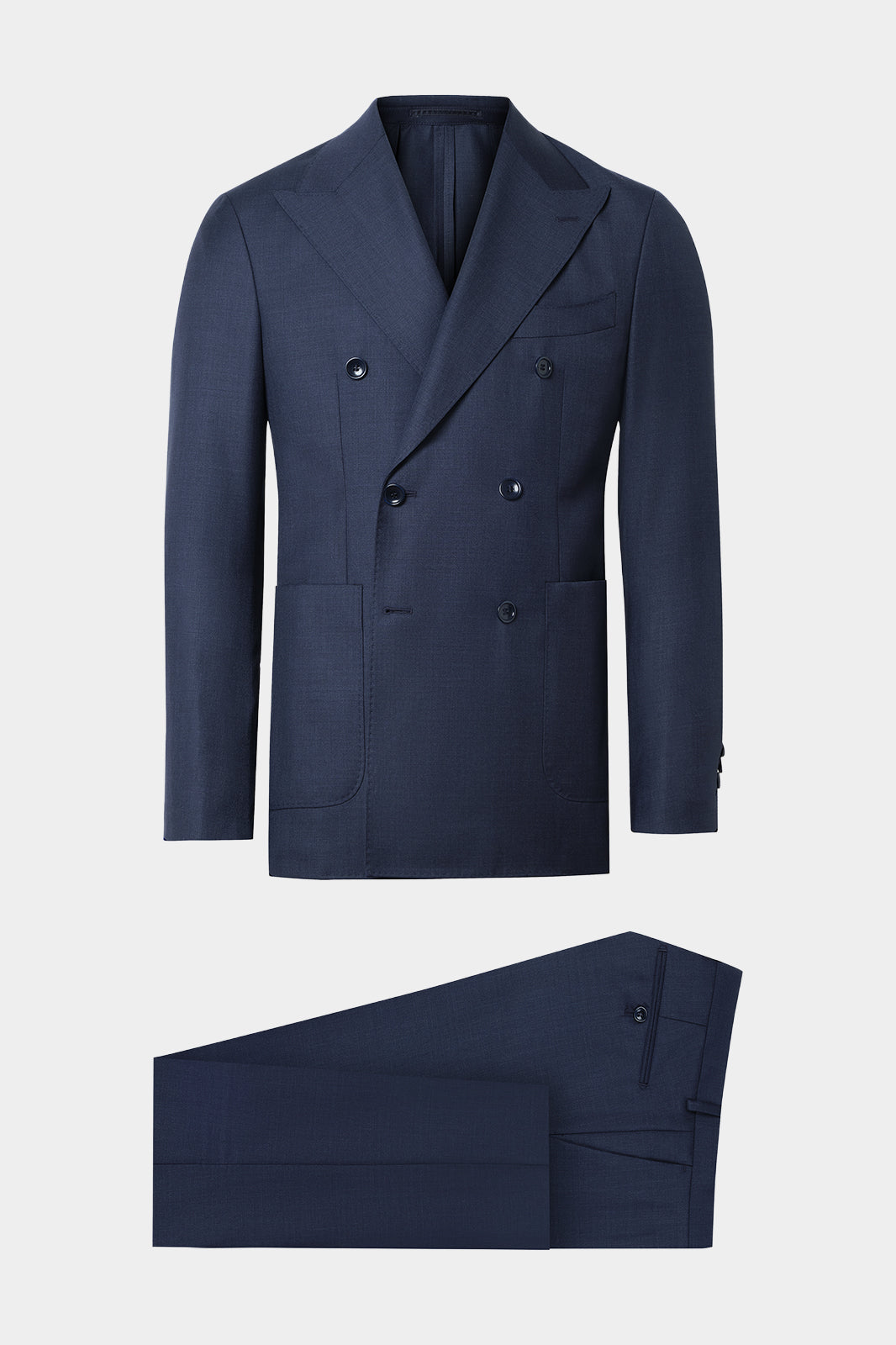 Vue sur fond blanc d'un costume croisé revers flèche non doublé et poche plaquée en 100% laine bleu foncé de chez Vitale Barberis Canonico.