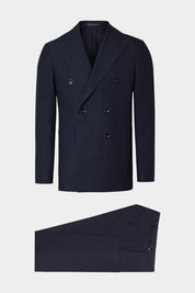 Vue sur fond blanc costume croisé poche plaquée et pantalon patte de serrage en Bleu foncé