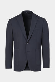 Vue sur fond blanc d'une veste de costume bon en coupe cintrée uni marine.