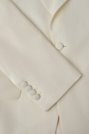 Smoking blanc et pantalon noir