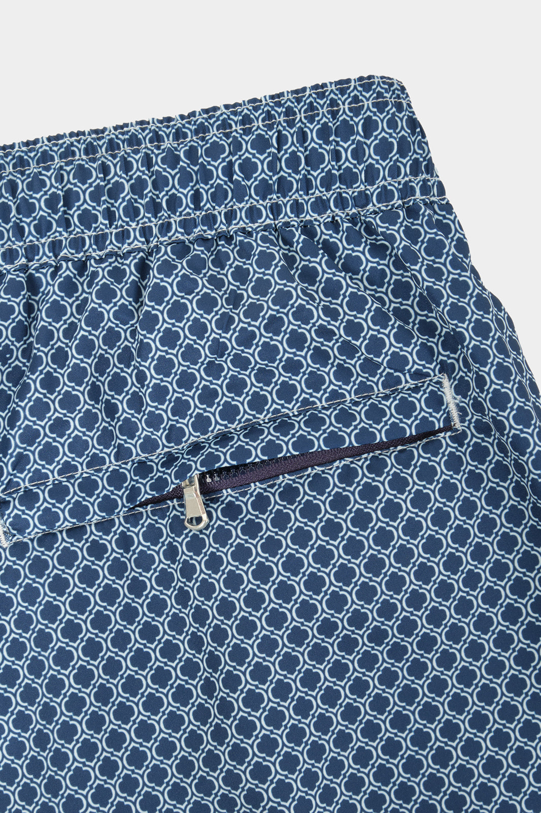 Kids' navy swim shorts with wave pattern