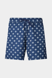 Vue sur fond blanc d'un short de bain couleur marine à fleurs blanche. Avec tissu à séchage rapide en 100% polyester.
