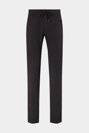 Vue sur fond blanc d'un pantalon jogpant technique poches zippées noir. Avec un tissu de chez Olmetex