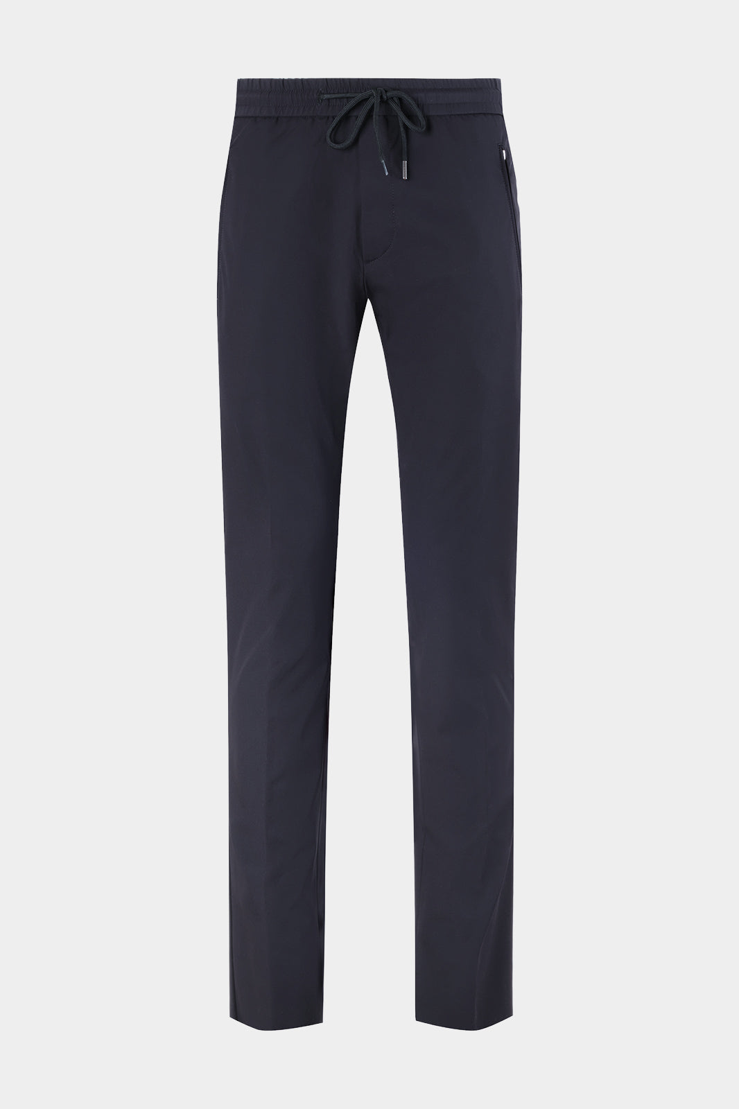 Vue sur fond blanc d'un pantalon jogpant technique poches zippées marine, coupe sport. Avec un tissu de chez Olmetex.