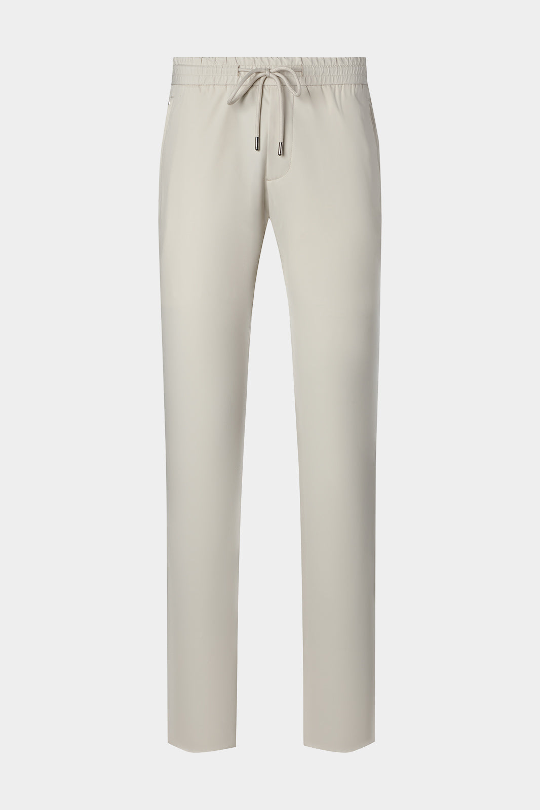 Vue sur fond blanc d'un pantalon jogpant technique poches zippées de coloris écru