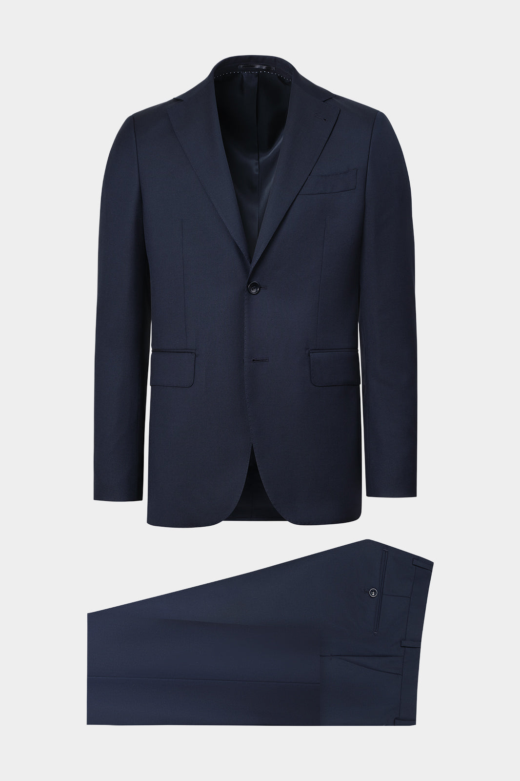 Vue sur fond blanc d'un costume en laine marine. Tissu en 100% laine de chez Vitale Barberis Canonico.