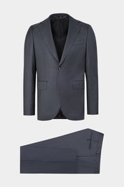 Vue sur fond blanc d'un costume revers large en vert foncé