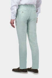 Pantalon jogpant en lin de couleur vert d'eau avec cordon de resserrage à la taille.